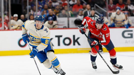 St. Louis Blues center Dylan Holloway (81) skates with the puck while Washington Capitals center Aliaksei Protas (21) chases him during the second period at Capital One Arena in Washington, D.C., on February 27, 2025.