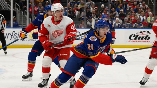 St. Louis Blues right wing Jimmy Snuggerud (21) skates against Detroit Red Wings right wing Jonatan Berggren (48) during the first period at Enterprise Center on April 1, 2025. St. Louis Blues right wing Jimmy Snuggerud (21) skates against Detroit Red Wings right wing Jonatan Berggren (48) during the first period at Enterprise Center on April 1, 2025.