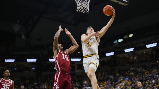  Feb 12, 2025; Columbia, Missouri, USA; Missouri Tigers guard Caleb Grill (31) shoots against Oklahoma Sooners forward Jalon Moore (14) during the first half at Mizzou Arena. 